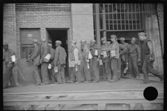 3833_Miners handing in lamps ,. Caples, West Virginia