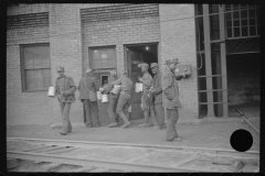 3841_Miners handing  in their  lamps . Caples, West Virginia