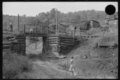 3887_Coal miner's children playing on the  track