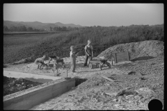 3895_ children playing in pile of  sand, Tygart Valley, West Virginia