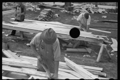 3939_ Carpenter shaping  gable of prefabricated house, Roanoke Farms, North Carolina