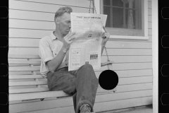 0546_ Newspaper reading , Tygart Valley Homestead .