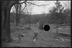 0852_Children playing on rudimentary rope swing,