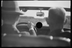 0940_Driving in open top car , unknown location .