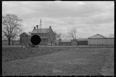 1228_Tractor ploughing,  on well equipped farm, unknown location