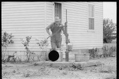 2018_Fetching a bucket of water from pump ( and well ) outside new build house