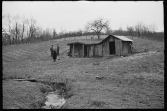 2460_Resettlement Administration representative outside client's  house/shack , Jackson County
