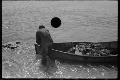 3205_Black American fisherman with his catch in his boat , Key West, Florida
