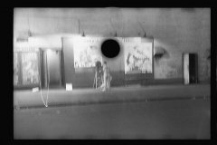 3396_Putting up movie posters at night, Washington, D.C