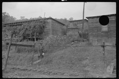 3571_Miner leaving his home , Bertha Hill, West Virginia