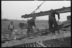 1189_ Lifting an RSJ into place for bridge construction .  Location unknown