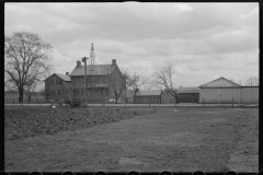 1228_Tractor ploughing,  on well equipped farm, unknown location