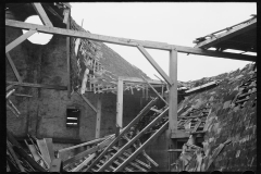 1315_ Red wooden farm structure , unknown location