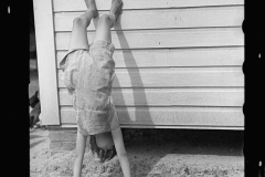 1319_ Youngster performing  a handstand , unknown location