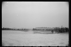 1400_ Open snowy landscape , agricultural land , unknown location.