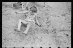 01544_Children enjoying a sandy slope . Irwinville farms , Georgia