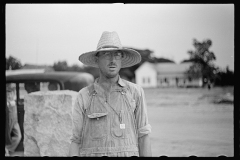 01552_Farmer looking curious , unknown situation or location