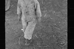 01572_Young child in stripey suit, unknown and location unknown