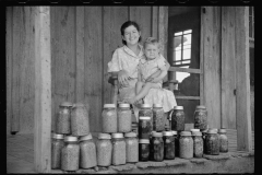 1633_ Unknown Wife with child on porch with Kilner jars of preserves