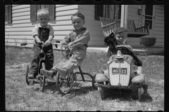 1650_ Three young boys, trikes and pedal car