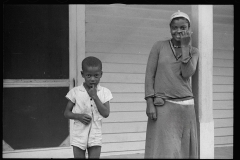 1717_Cheerful  black-American children outside their house