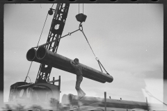 2258_Unloading a sewer pipe by crane, Greenbelt construction, Maryland