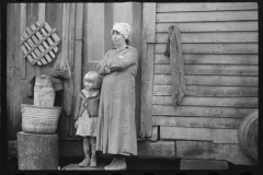 2444_ Rehabilitation client's wife and child  in the doorway of their home , Jackson County, Ohio