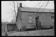 2457_Resettlement Administration representatives at door of client's house