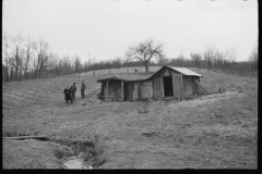 2462_Resettlement Administration representative outside client's  house/shack , Jackson County