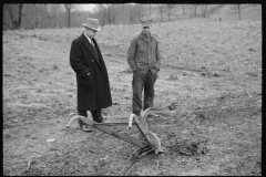 2466_Resettlement Administration agent with client and possibly broken Plough