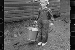 2774_Yound daughter with pail , rehabilitation client, Lamoille County, Vermont