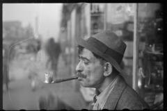 3062_Man in street with homemade pipe , Washington D.C.