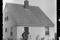 3086_Resettled farmer on steps of  their new home, Wabash Farms, Indiana