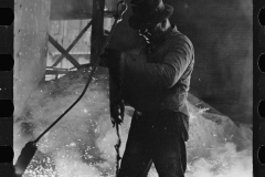 3099_Worker attaching crane hook ,  Blast Furnace, Pittsburgh, Pennsylvania