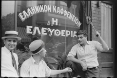 3126_Steelworkers talking to the proprietor of a coffee shop , 'Liberty'  Aliquippa, Pennsylvania]