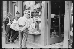 3128_Steelworkers reading the newspaper outside liquor store, Aliquippa, Pennsylvania