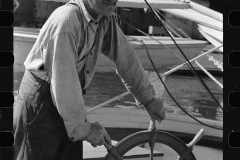 3182_Oysterman at wheel of boat, Bivalve, New Jersey