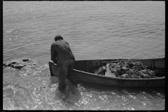 3205_Black American fisherman with his catch in his boat , Key West, Florida