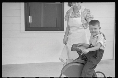 3431_Mrs Pope and son on his trike , Irwinville Farms, Georgia