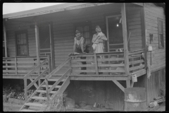 3573_Coal miner, his wife and baby living in a  company shanty,  Scotts Run, West Virginia