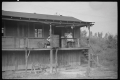 3586_Haircutting  on front porch . Chaplin, West Virginia