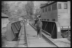 3697_Miner going home after work, children going to school