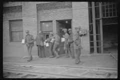 3841_Miners handing  in their  lamps . Caples, West Virginia