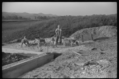 3894_ Children playing in pile of  sand, Tygart Valley, West Virginia