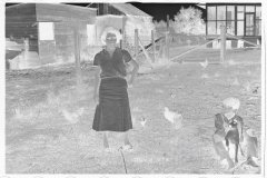 0049_Resettlement  farmers wife and son with dog