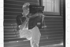 0546_ Newspaper reading , Tygart Valley Homestead .