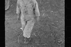 01572_Young child in stripey suit, unknown and location unknown