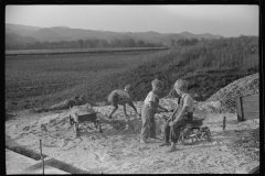 3714_Children playing in pile of sand, Tygart Valley, West Virginia