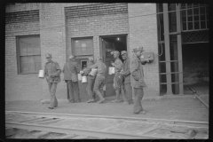 3841_Miners handing  in their  lamps . Caples, West Virginia