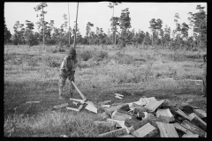 0057_African -American  boy chopping wood